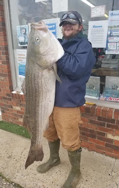 Fisherman John Callahan Catches Nearly 60-Pound Striped Bass At New Jersey Beach.jpg