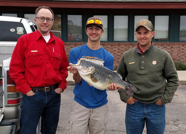 Wyoming bass fishing record Caleb Salzman (center) after he caught a state-record largemouth.png