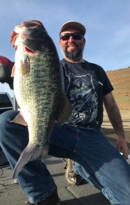 I made the cast with the bait of choice based on the angle and structure that was in front of us. I said two things after the lure splashed down. First was &ldquo;that was the cast I&rsquo;ve been dreaming of&rdquo; followed by &ldquo;I&rsquo;m either going to get stuck, or stick a good one&rdquo;. As I patiently and purposely retrieved the lure we were both on high alert. Then suddenly a lightning bolt of a strike hit, I swung back and the fight was on. Typically, with a large bait and heavy line a rod down grind the fish to the boat method of landing works best. But on this fish, I couldn&rsquo;t makeup much ground and felt as if the line was going to break if I applied anymore pressure. I had to back off the drag and actually play the fish wisely. At this point I knew it was a true giant and not the 4-pounder we had seen previously. It surged deep peeling drag, threatened to go back into wood and ultimately ended up in shallow water behind some sharp rocks. Unlike most of these behemoths it never broke the surface. Our first true look at it out of the water was in the net as Rob hoisted it aboard.
We removed the hook and put her in the live well immediately without really understanding the true size. However, we both agreed it was at least a Double-digit fish. After a series of fist-bumps and hollers we went back to the next area. It was hard to gather composure and we couldn&rsquo;t stop talking about what just happened. Now we just need to fill out a limit as big fish and pretty much all the weight we needed was accounted for. We went back to finesse techniques and picked up another small keeper.
CONTINUE
&nbsp;