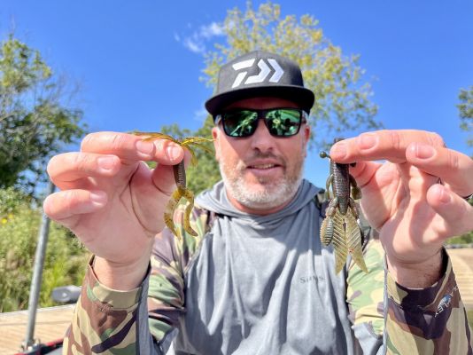 Finesse Jigs
When fishing small finesse jigs, Hite often selects a jig trailer that allows the jig to fall quickly. One of his favorites is a 3.75-inch Yamamoto Fat Baby Craw.
"It's great on a ball head finesse jig or any little jig," he said. "That trailer falls fast because it's just a craw and there is less resistance because it doesn't have any appendages on the side."
One place where it shines over other trailers, according to Hite, is deeper water. "It's great for deeper water because it kicks better, and I think you have a better feel of the jig itself since there isn't the same resistance as bulkier trailers."
Another one of his favorites is the tried-and-true Yamamoto Hula grub, fished solo on a football head jig.
"That is the bait I used to catch the biggest bass of my life, a 13-9 from Lake Roosevelt," he said. "It's great for deeper water because it doesn't have much resistance and falls much faster than a jig with a silicone skirt on it. For anything &frac12;-ounce and above, I like the 5-inch version and use the smaller 4-inch version for lighter jigheads because it has more kick and doesn't need much to get those tails to move."