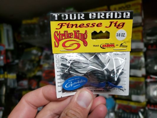 Tour Grade Finesse Football Jig
This hook is part of the Tour Grade lineup so it has all premium components starting with a Gamakatsu hook.
As the name implies, it is a football head and features the finesse style skirt with a long skirt flowing from the underside of the banded skirt and a trimmed &ldquo;finesse style&rdquo; skirt for the top layer. This helps to make a more compact presentation.
It comes in two finesse sizes: &frac14;-ounce and 3/8-ounce. It has some other nice features like the tapered bard on the hook shank to keep your plastic trailer secured.
