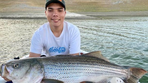 Hunter Turner shows off his personal-best 30-pound striper caught July 31 at San Luis Reservoir.jpg