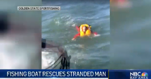 fishing boat saves man in water.png